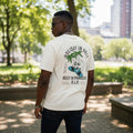 "Holiday In Hell" Tropical Skull Unisex Graphic Tee (Off-White) - Size L