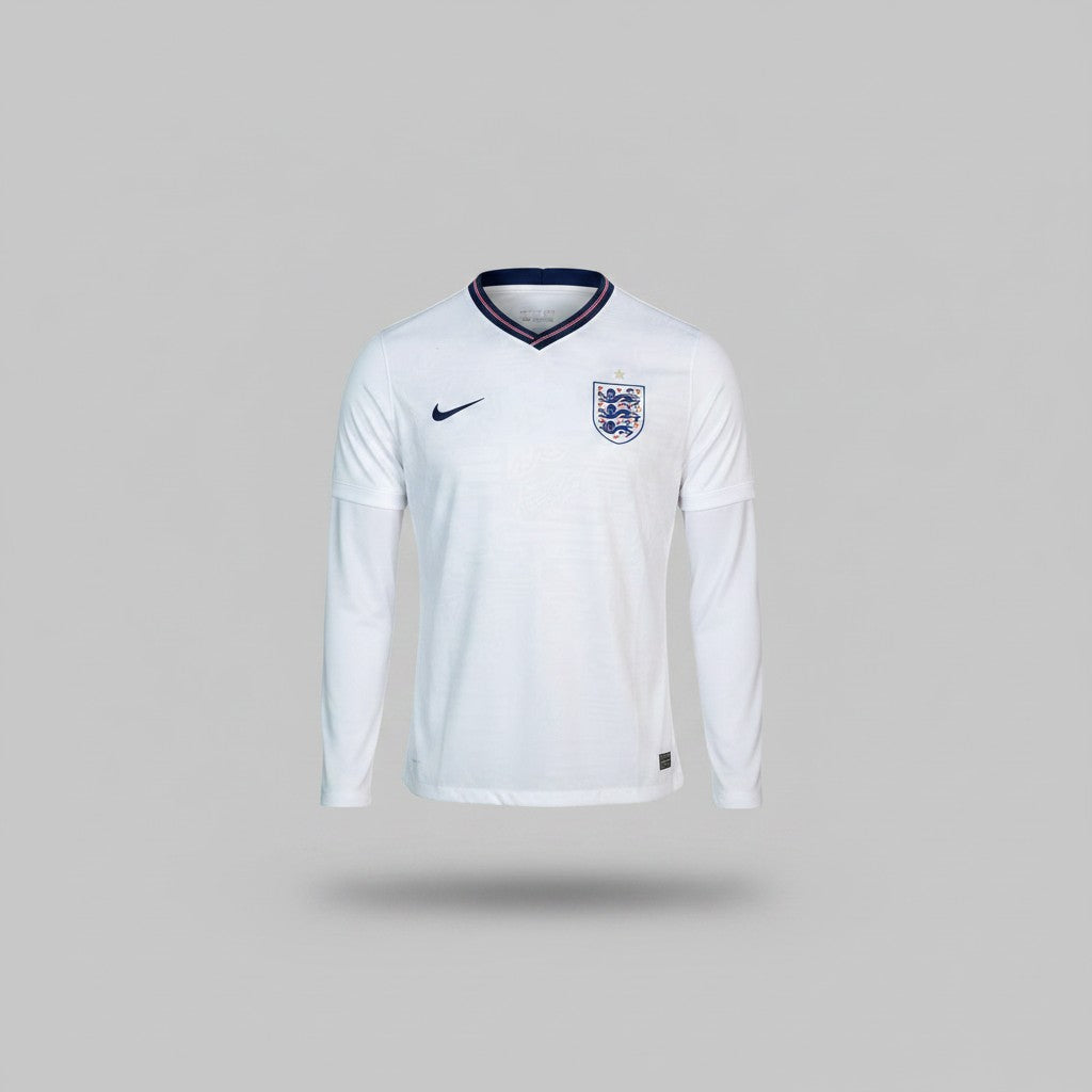 White long sleeve football jersey with navy V-neck collar, red and white stripe trim and embroidered shield crest