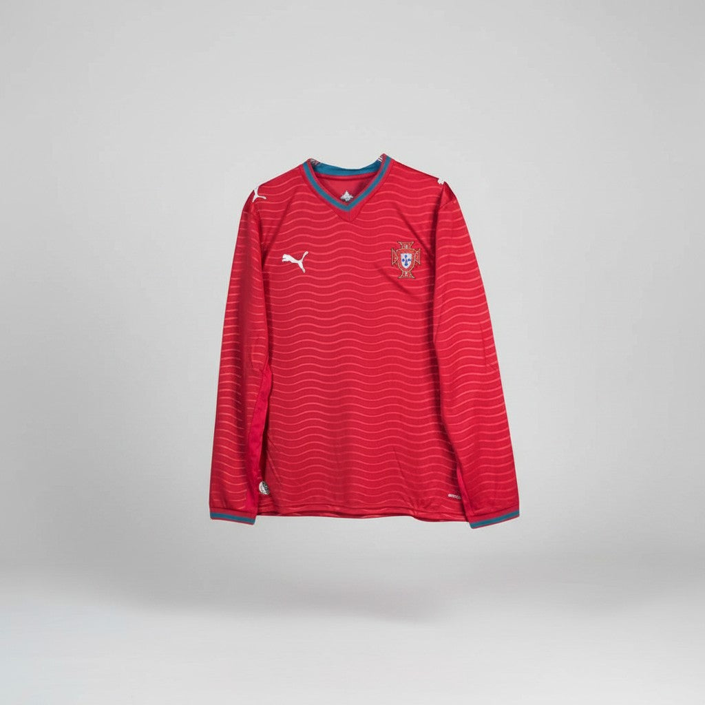 Crimson red long sleeve football jersey with tonal wave stripe texture, teal V-neck collar and teal ribbed cuffs
