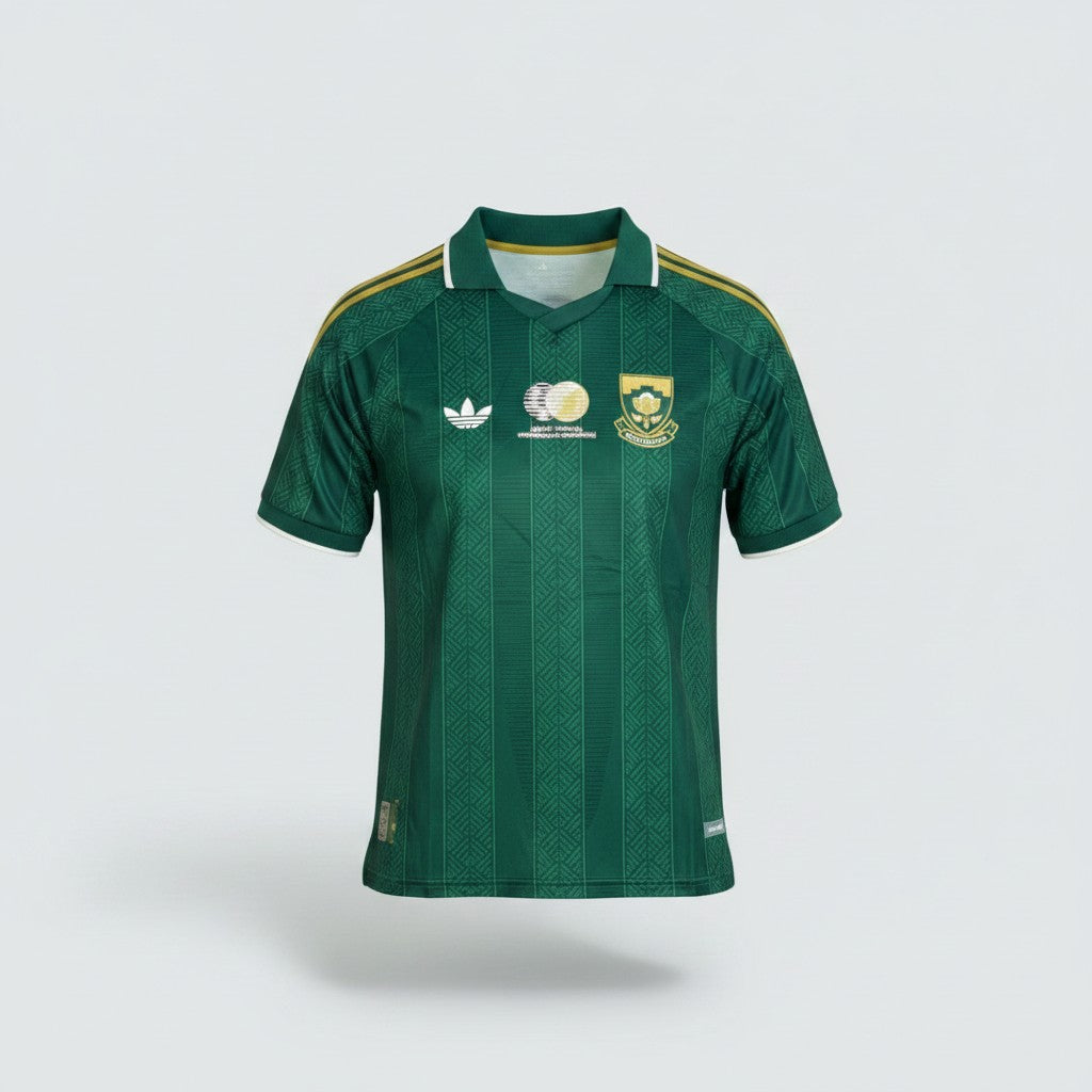 Deep forest green retro polo football jersey with tonal jacquard texture, gold three-stripe shoulders and embroidered gold shield crest