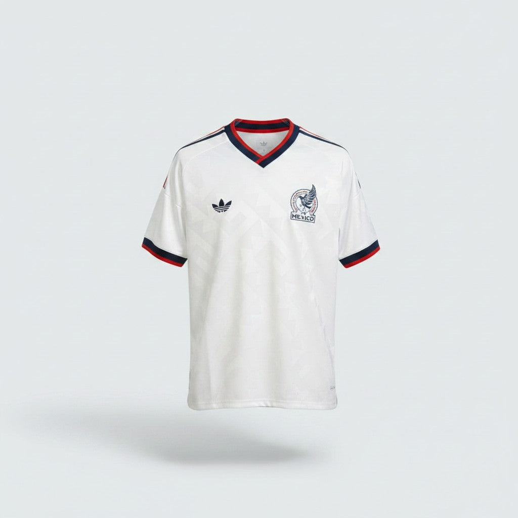 White retro away football jersey with navy V-neck collar, red stripe trim, navy three-stripe shoulders and embroidered circular eagle crest