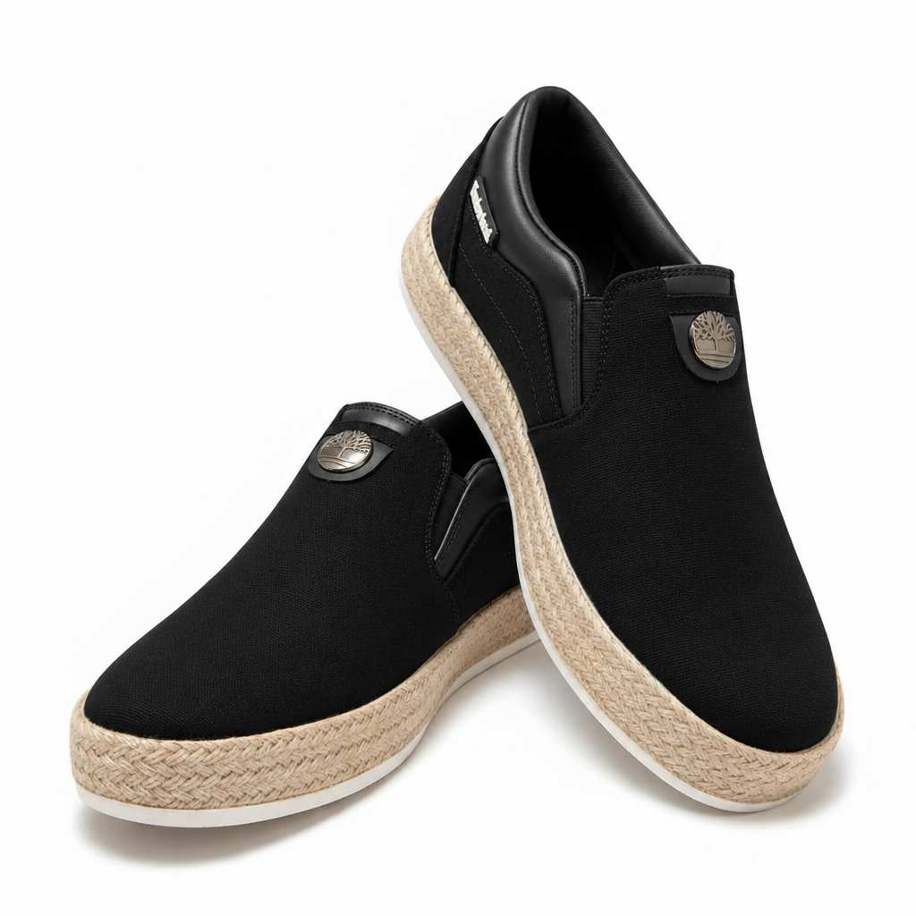 Black canvas slip-on sneakers with beige woven soles