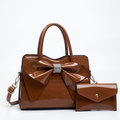 Brown bow handbag studio preview