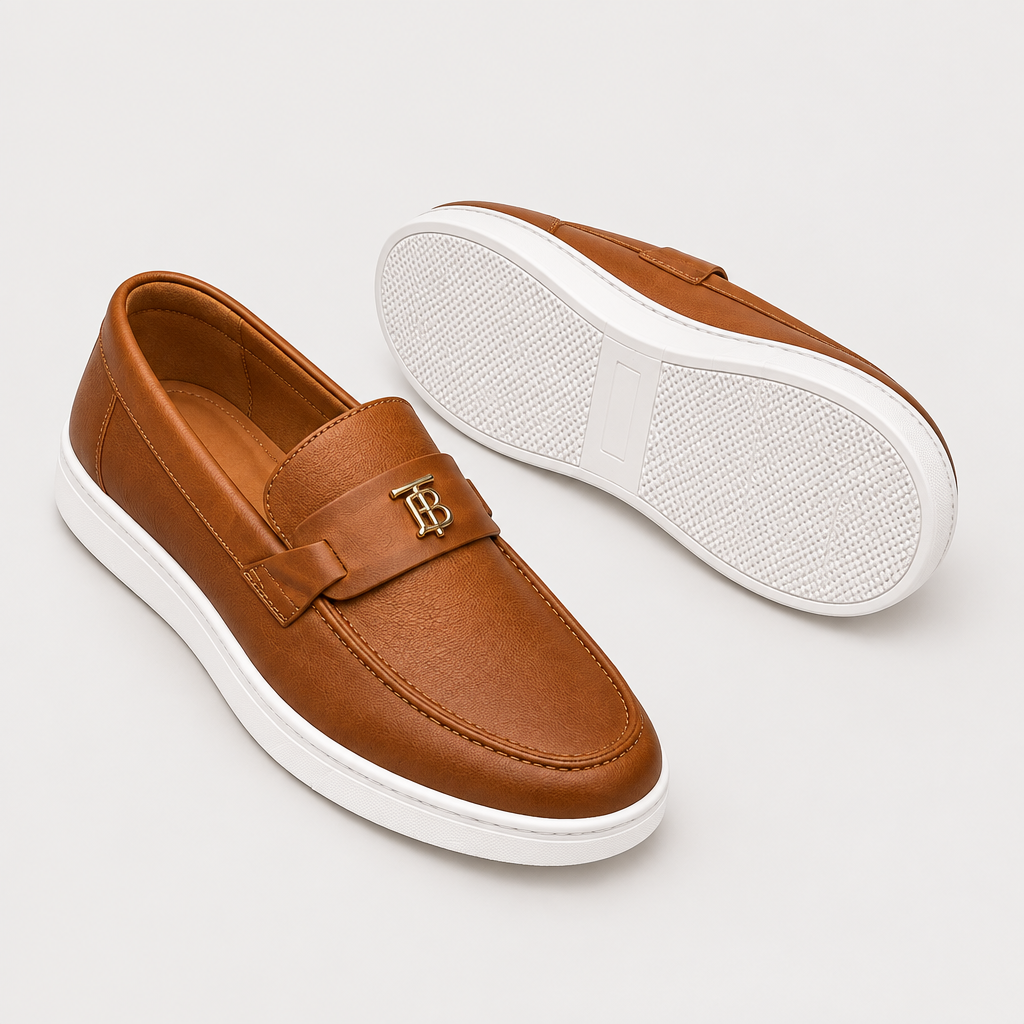 Catalog shot of tan leather buckle-strap loafers