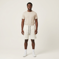 Full-body Black adult model wearing white drawstring shorts