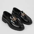 Glossy black loafers with metallic hardware pair shot