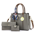 Grey scarf-handle handbag studio preview