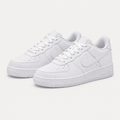 Pair of white low-top sneakers with perforated toes