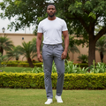 Nigerian male model wearing men's slate grey chinos trousers