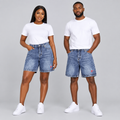 Woman and man wearing washed blue denim shorts with pink accent together