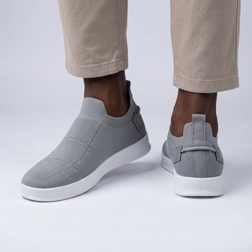 Grey knit slip-on sneakers worn by a Black male model, front and heel views