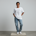 Nigerian female model front view wearing white rhinestone collegiate skeleton tee