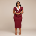 Black Nigerian model wearing the burgundy peplum skirt suit with white collar