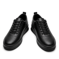 Pair of all-black textured lace-up sneakers on a white background
