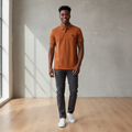 Young Nigerian male model wearing rust brown tipped collar polo shirt