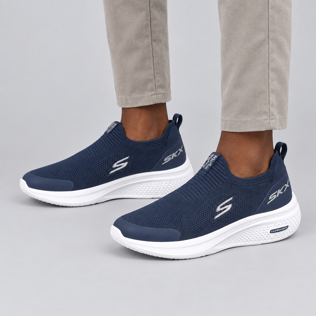 Both navy knit slip-on sneakers worn against a plain studio background