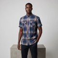 Nigerian male model wearing navy tartan plaid short-sleeved shirt