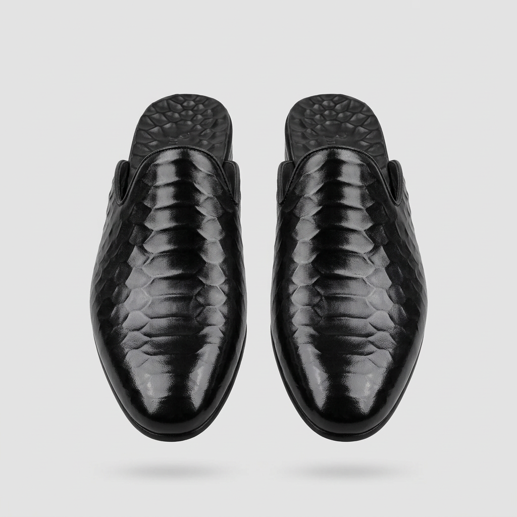 Men's black quilted-texture backless mule shoes, straight-on view of the pair