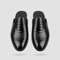 Men's black quilted-texture backless mule shoes, straight-on view of the pair