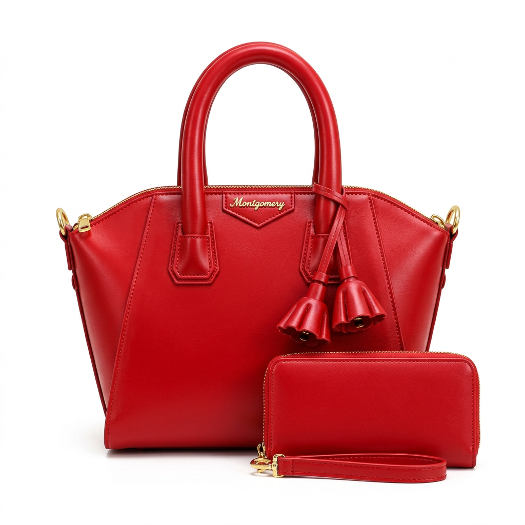 Red twin-handle handbag with hanging tassel details pictured with matching zip wristlet