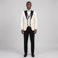 Full-body Black adult model wearing an ivory formal suit with black peak lapels and black trousers