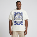 Nigerian man wearing white blue-badge graphic T-shirt