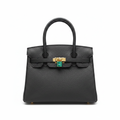 Ghost mannequin view of black pebbled leather structured tote bag with gold hardware and padlock clasp