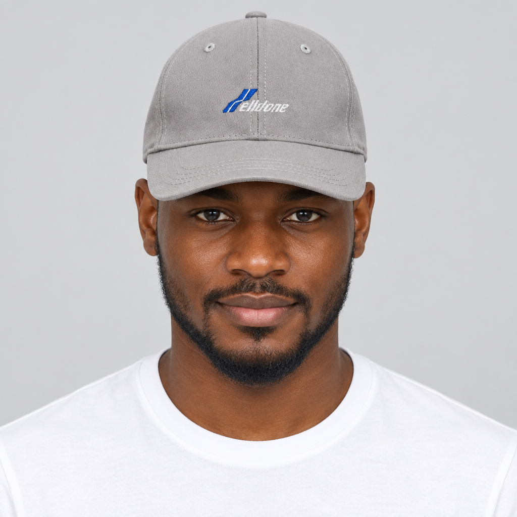 Model wearing unisex light grey embroidered baseball cap