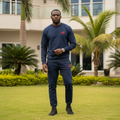 Nigerian male model wearing navy blue fleece crewneck tracksuit set