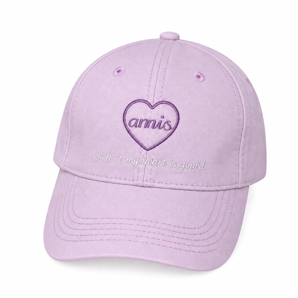 Soft pink heart-embroidered baseball cap on white