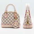 AI-generated front and side views of a cream and grey checkerboard dome handbag with flower pouch