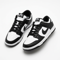 Black and white low-top sneaker pair on white