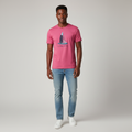 Young Nigerian male wearing vibrant hot pink sailboat graphic crew neck tee