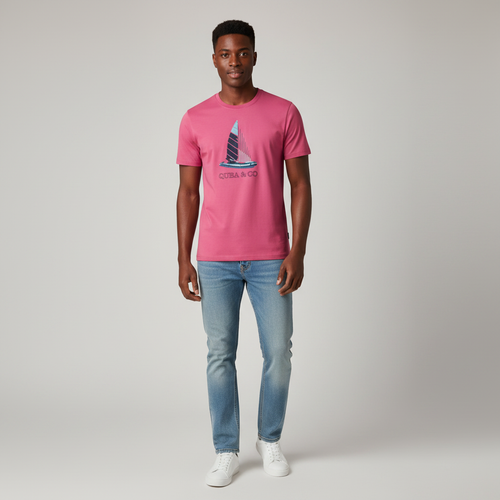 Young Nigerian male wearing vibrant hot pink sailboat graphic crew neck tee