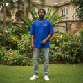 Nigerian male model wearing royal blue wild west graphic oversized tee – front view