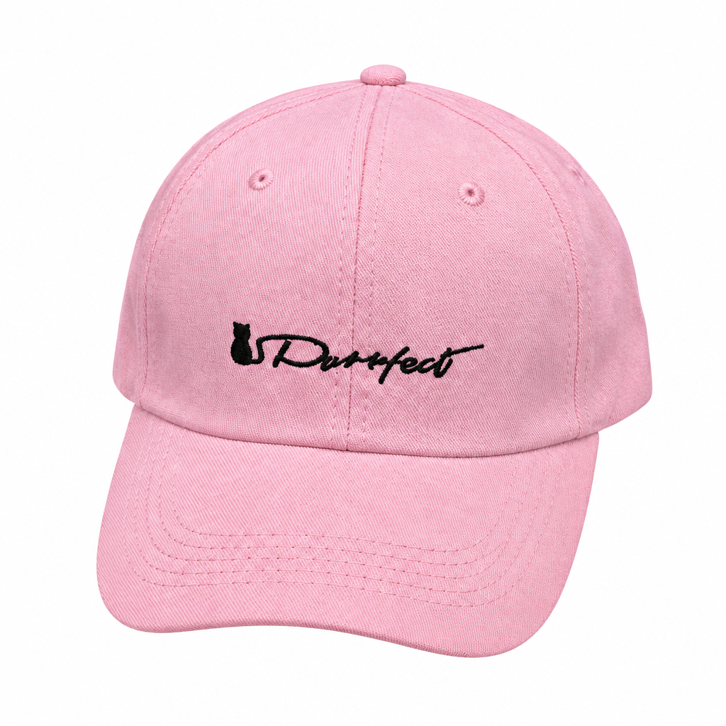 Pink baseball cap with black script embroidery on white background