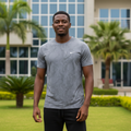 Nigerian male model wearing cool grey tonal camo print athletic performance tee