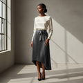 Nigerian model wearing grey asymmetric bow pleated skirt