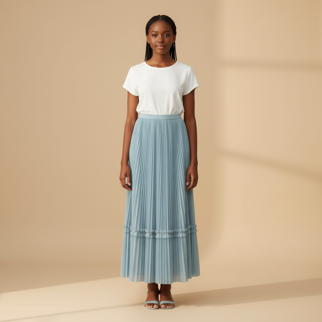 Nigerian girl wearing dusty blue pleated midi skirt - front view