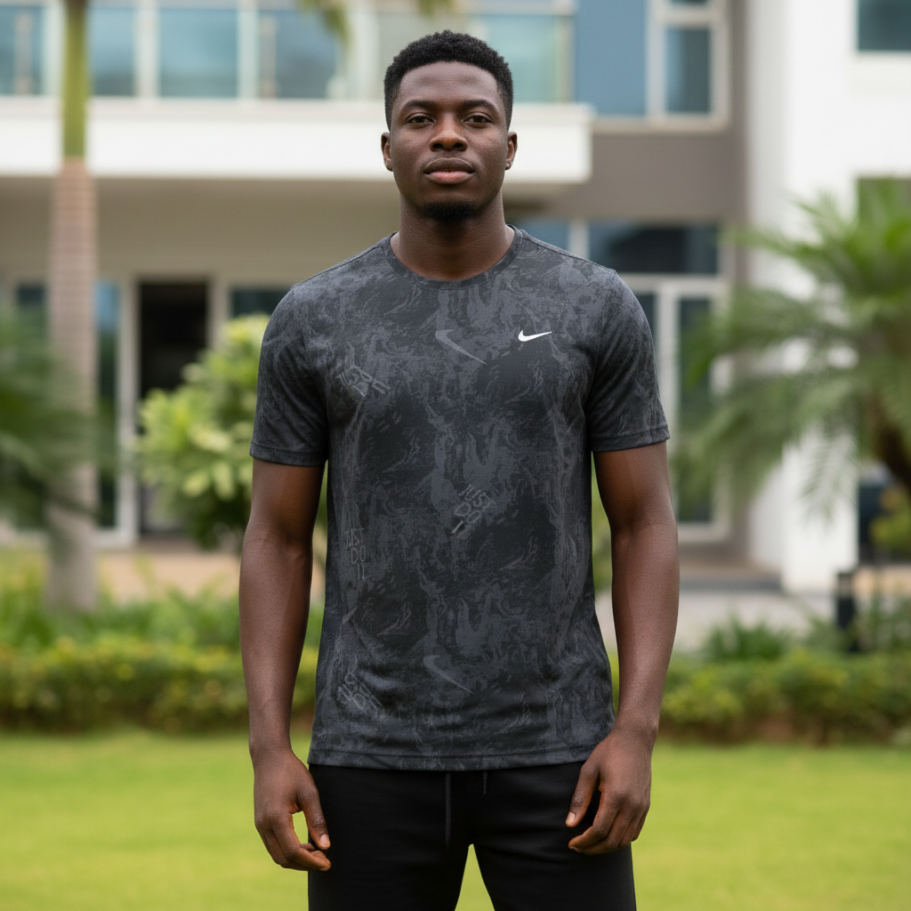 Nigerian male model wearing dark charcoal camo print athletic performance tee