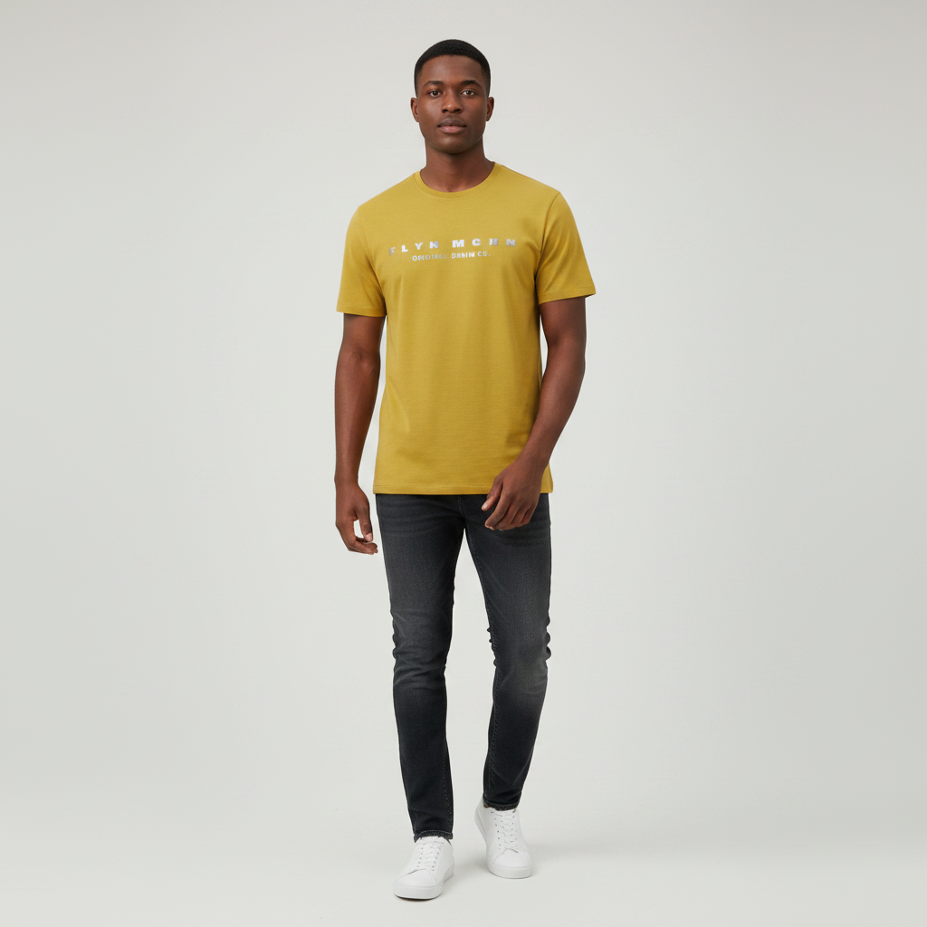 Young Nigerian male wearing mustard yellow metallic print crew neck tee