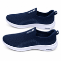 Pair of navy stitched-panel slip-on sneakers on white