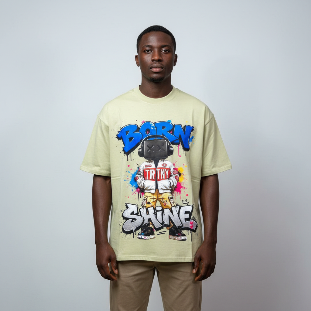 Model wearing the sage green graffiti character graphic tee