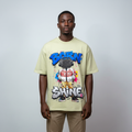 Model wearing the sage green graffiti character graphic tee