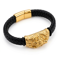 Black braided bracelet with sculpted gold-tone centrepiece and matching clasp on white background