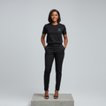 Nigerian female model front view wearing black teal embroidered monogram T-shirt