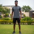 Nigerian male model wearing charcoal grey plain short-sleeve sports jersey