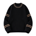 Black knit sweater with beige double stripes at the crew neckline and sleeves