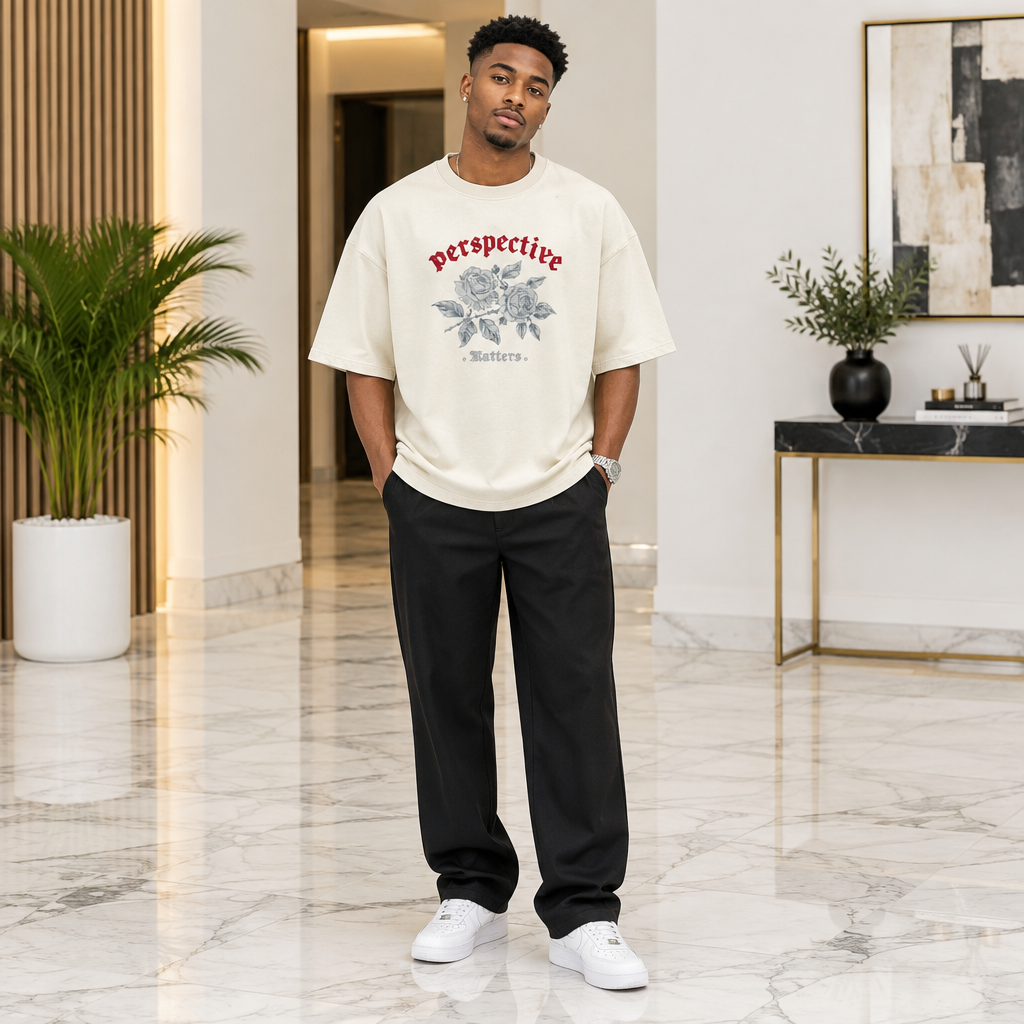 Man wearing cream oversized rose Perspective graphic tee