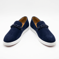 Pair of navy chain-detail slip-on shoes with white soles